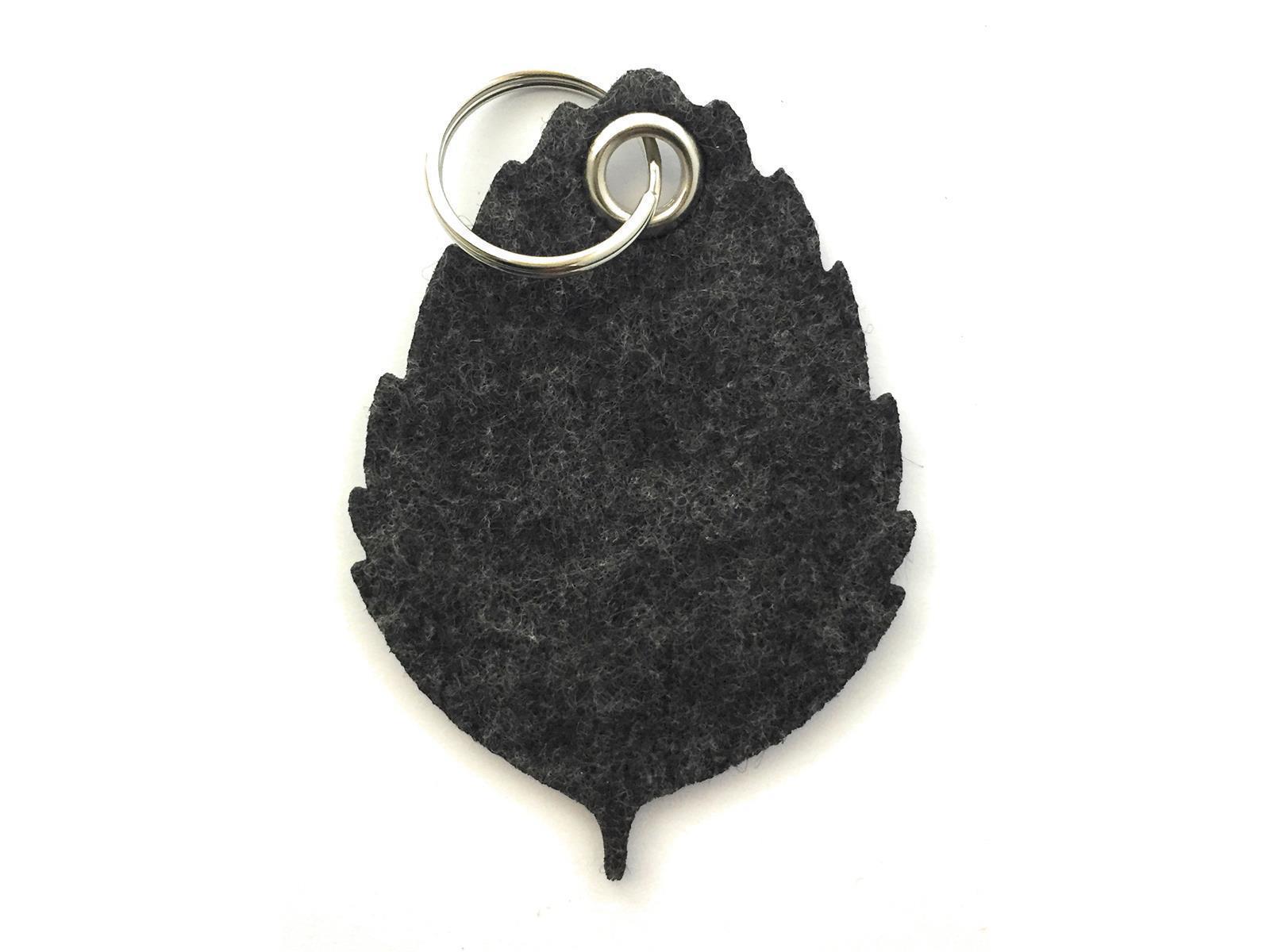 Blatt No1 - Schlüsselanhänger Filz in schwarz meliert mit Druck 4-fbg