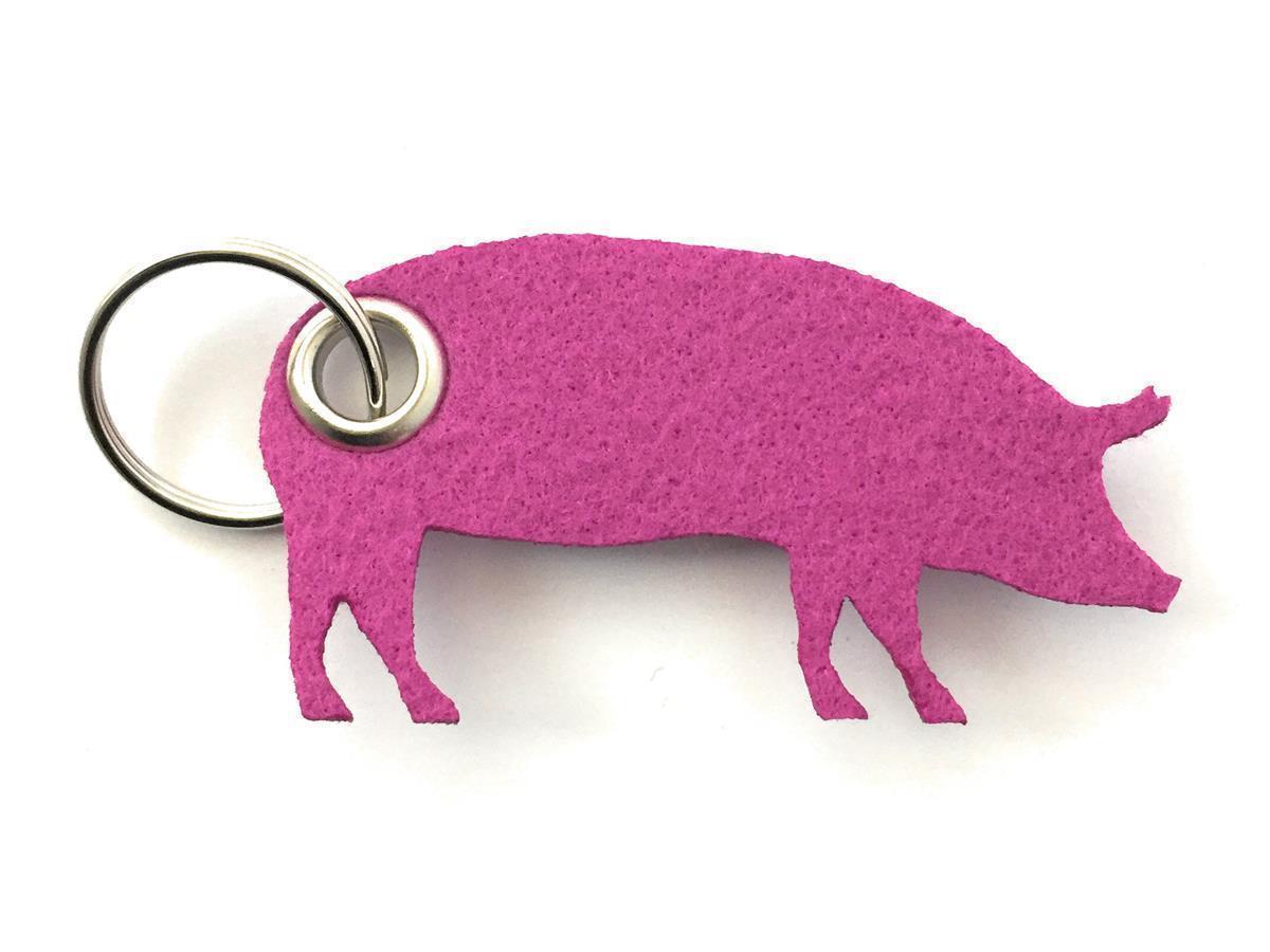Hausschwein - Schlüsselanhänger Filz in magenta - Druck / Gravur Hausschwein - Schlüsselanhänger Filz in magenta mit Druck 4-fbg