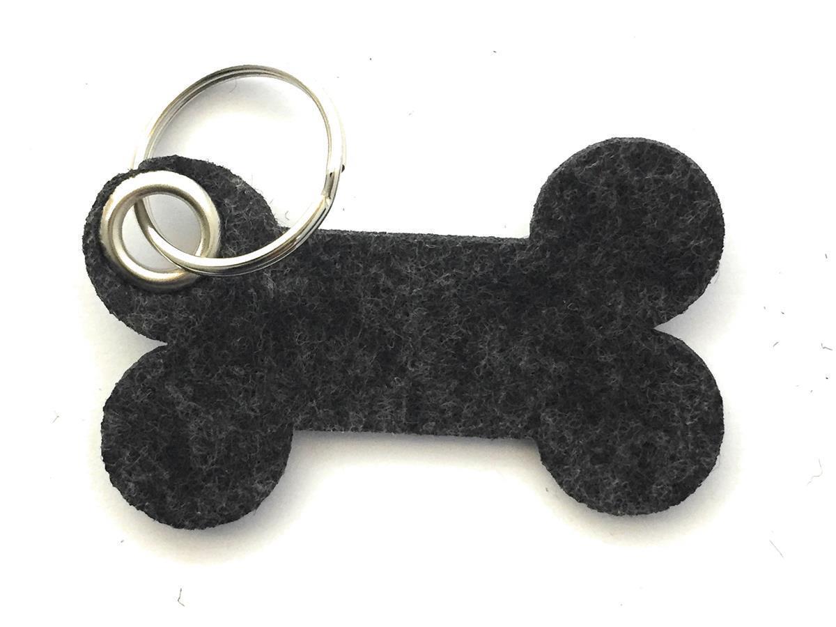 Knochen - Schlüsselanhänger Filz in schwarz meliert - Druck / Gravur Knochen - Schlüsselanhänger Filz in schwarz meliert mit Druck 4-fbg