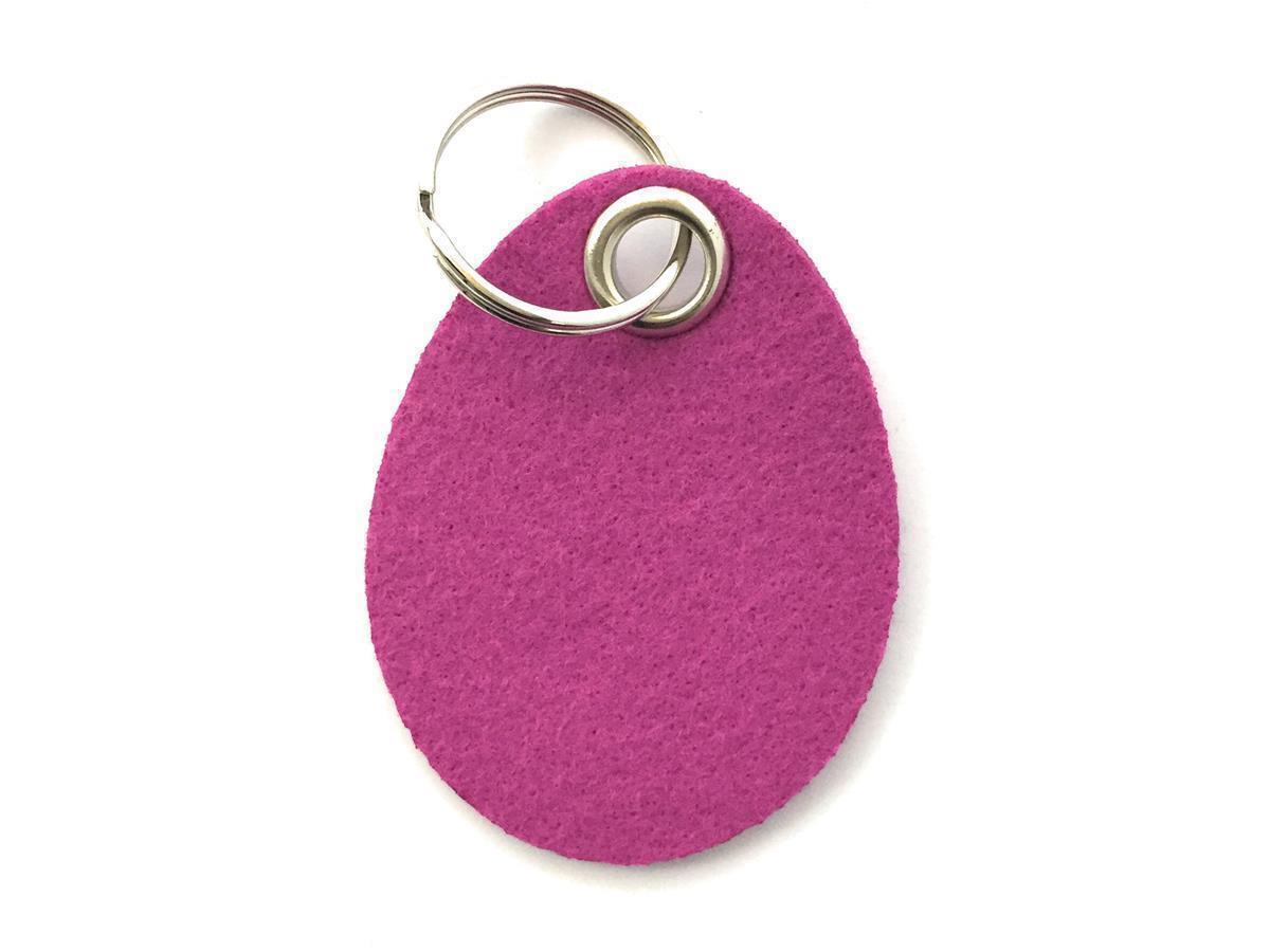 Ei- Schlüsselanhänger Filz in magenta - Druck / Gravur Ei- Schlüsselanhänger Filz in magenta mit Druck 4-fbg